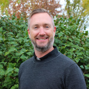 Sean Barnes in front of tree